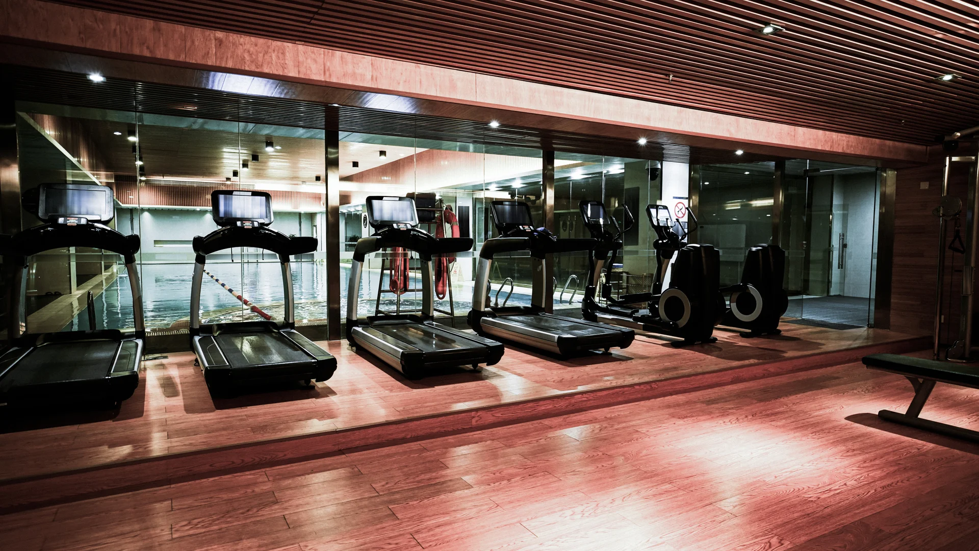 Treadmills looking out to a pool